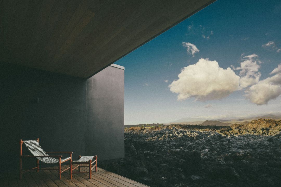 Spa deck with lounge chairs facing a  Hawaiian landscape.